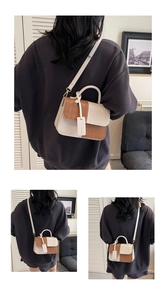 Detail of color-block crossbody bag with quilted texture and chic top handle