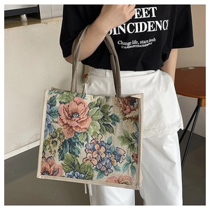 Detailed close-up of large floral linen tote bag showing thick woven fabric and sturdy strap