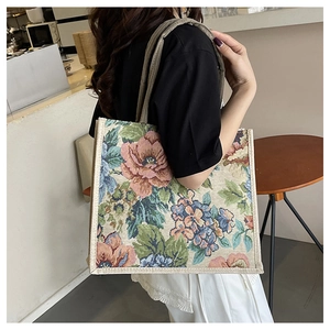 Detail of floral tapestry linen tote bag showing vintage flower patterns and texture