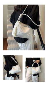 Vue détaillée d'un sac en dentelle blanche avec broderie papillon et pompon élégant