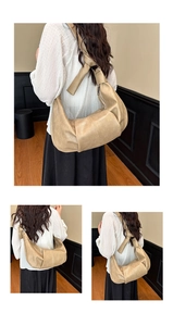 Detail of the knotted shoulder strap and pleated texture on the beige hobo bag