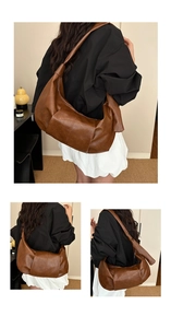 Detailed view of brown large-capacity soft leather hobo bag with pleats and knot detail