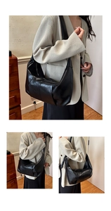 Detail view of the black retro pleated hobo bag with high-quality soft faux leather texture