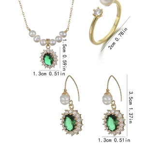 Vintage jewelry set with emerald zircon pendants and pearls including necklace and earrings