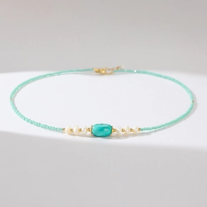 Detailed macro view of vintage turquoise beads and natural freshwater pearls necklace