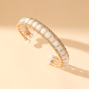 Handmade gold wire open bangle with natural green stones and elegant white pearls