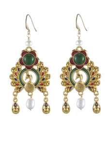 Detailed view of peacock earrings with green gemstones, red enamel and white pearls