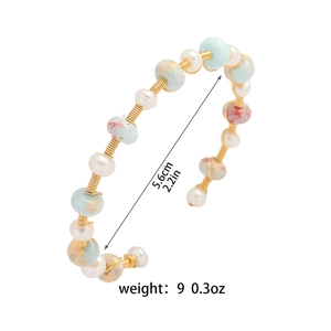 Minimalist wire-wrapped open bangle with natural pearls and colorful marble beads