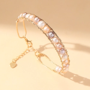 Handmade gold wire-wrapped pearl bracelet with natural colorful pearls and heart charm