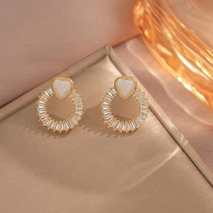 Elegant gold heart opal earrings with zircon halo on a premium jewelry display box