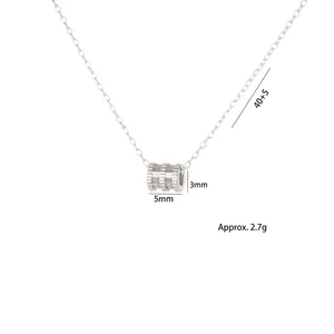 Silver cylinder pendant necklace with textured finish and adjustable chain length