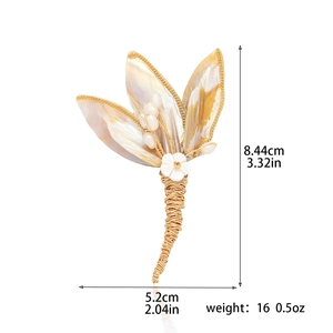 Elegant natural shell flower brooch with pearls and golden wire wrap design