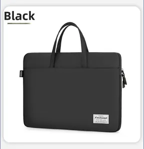 Close-up of durable black fabric laptop bag with elegant brand tag and fashion labels