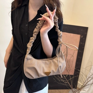 Chic light brown ruched shoulder bag with gold metal logo and bow detail for women