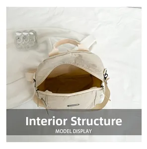 Top view of spacious nylon bag interior with internal pockets and metal zipper detail