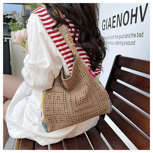 Bohemian crochet tote bag with colorful floral patterns shown in an outdoor setting