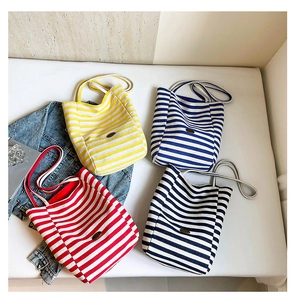 Detailed collection of striped canvas tote bags in yellow, navy, red, and black styles