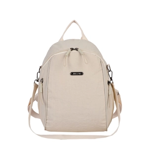 Minimalist beige nylon backpack for women featuring a metal logo plate and front zipper