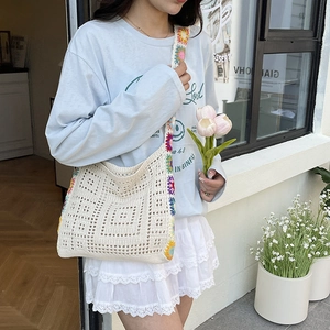 Knitted hollow tote bag with colorful sunflower crochet for summer beach vacation