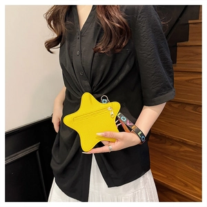 Fashionable star-shaped yellow mini bag with 'LOVE' strap and textured leather finish