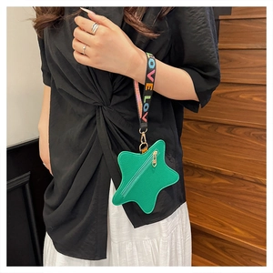 Star-shaped green pebbled leather coin purse with a LOVE patterned wristlet strap