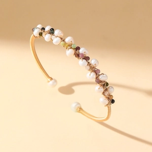 Baroque style gold wire-wrapped open cuff bracelet with white pearls and colorful stones