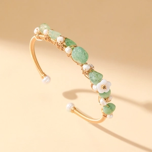 Handcrafted gold wire-wrapped bangle featuring green aventurine stones and white pearls