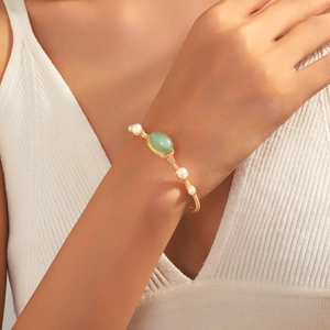 Handmade gold wire open bangle with natural green aventurine and white pearls