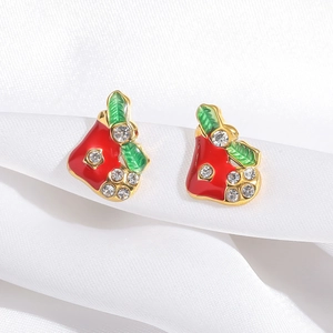 Sparkling red apple enamel earrings with crystals on luxury white satin background