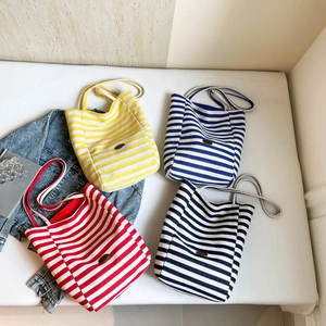 Chic striped canvas tote bags in yellow, blue, red and black for casual summer outings