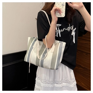 Detailed view of the large capacity canvas tote bag with stylish vertical stripes