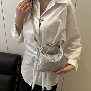 Silver snakeskin pattern Lindy style handbag with gold hardware and shoulder strap