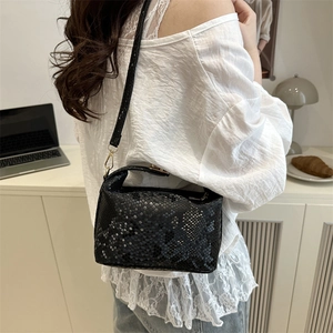Fashionable black snake-pattern top handle pillow bag with golden metal hardware
