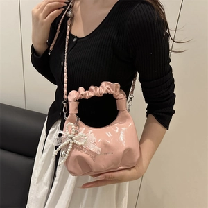 Pink glossy ruched underarm cloud bag with pearl bow charm and chain strap