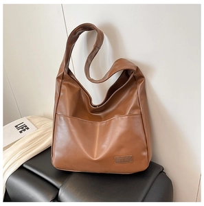 Detail of a brown PU leather Hobo shoulder bag featuring a Fashion & Bags rectangle label