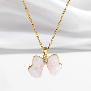 Golden butterfly necklace with pink crystal wings and sparkling zircon pendant for women