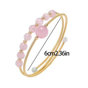 Pink cat eye bead open bracelet with gold-plated spring wire and 6cm diameter