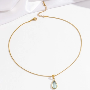 Gold-plated stainless steel snake chain necklace with a light blue pear-shaped pendant