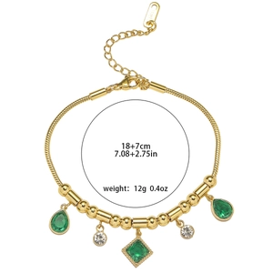 Gold snake chain bracelet featuring emerald green teardrop stones and white zircon accents