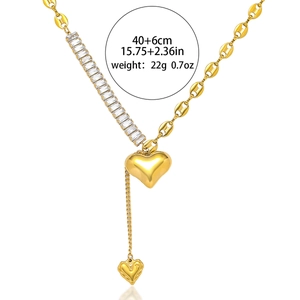 Gold asymmetrical heart tassel necklace with crystals and stainless steel curb chain