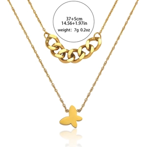 Collier double rang doré avec pendentif papillon, chaîne à maillons et fermoir ajustable