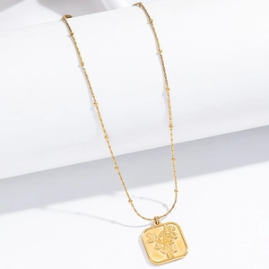Gold square rose embossed pendant necklace with satellite chain on white background