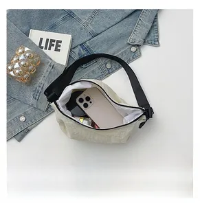 Internal view of cream dumpling bag showing capacity for phone and cosmetics