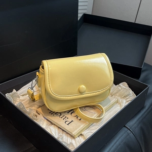 Pale yellow leather crossbody bag with lychee texture in a luxury gift box