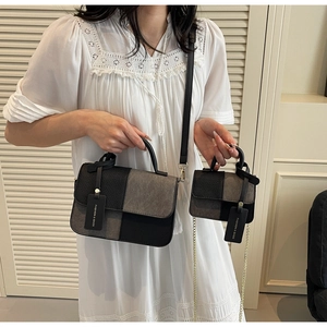 Detail of color-block woven bags in large and small sizes with leather and chain straps