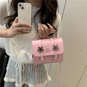 Pink PU leather square bag with star studs and handle, shown in a mirror selfie