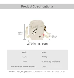 Detail view of cream nylon crossbody bag with dimensions 15.5x22x5.5cm and strap info
