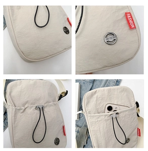 Detail of off-white nylon crossbody bag showing drawstring closure and fashion woven label