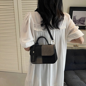 Fashionable color-block rectangle handbag in black and grey with a sleek top handle