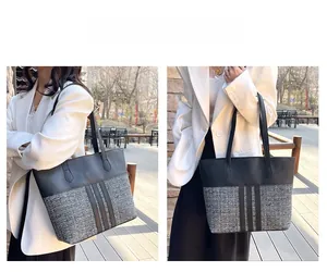 Outdoor model shot showing the large capacity black PU and tweed patchwork tote bag